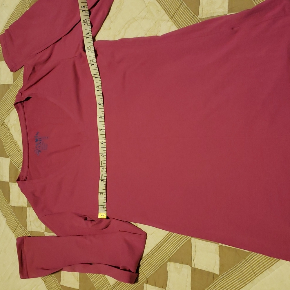 Like new. V neck long sleeve T. Fabric very soft. Stretchy . Wore twice